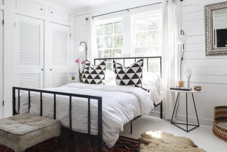 Bed with headboard in front of window sale